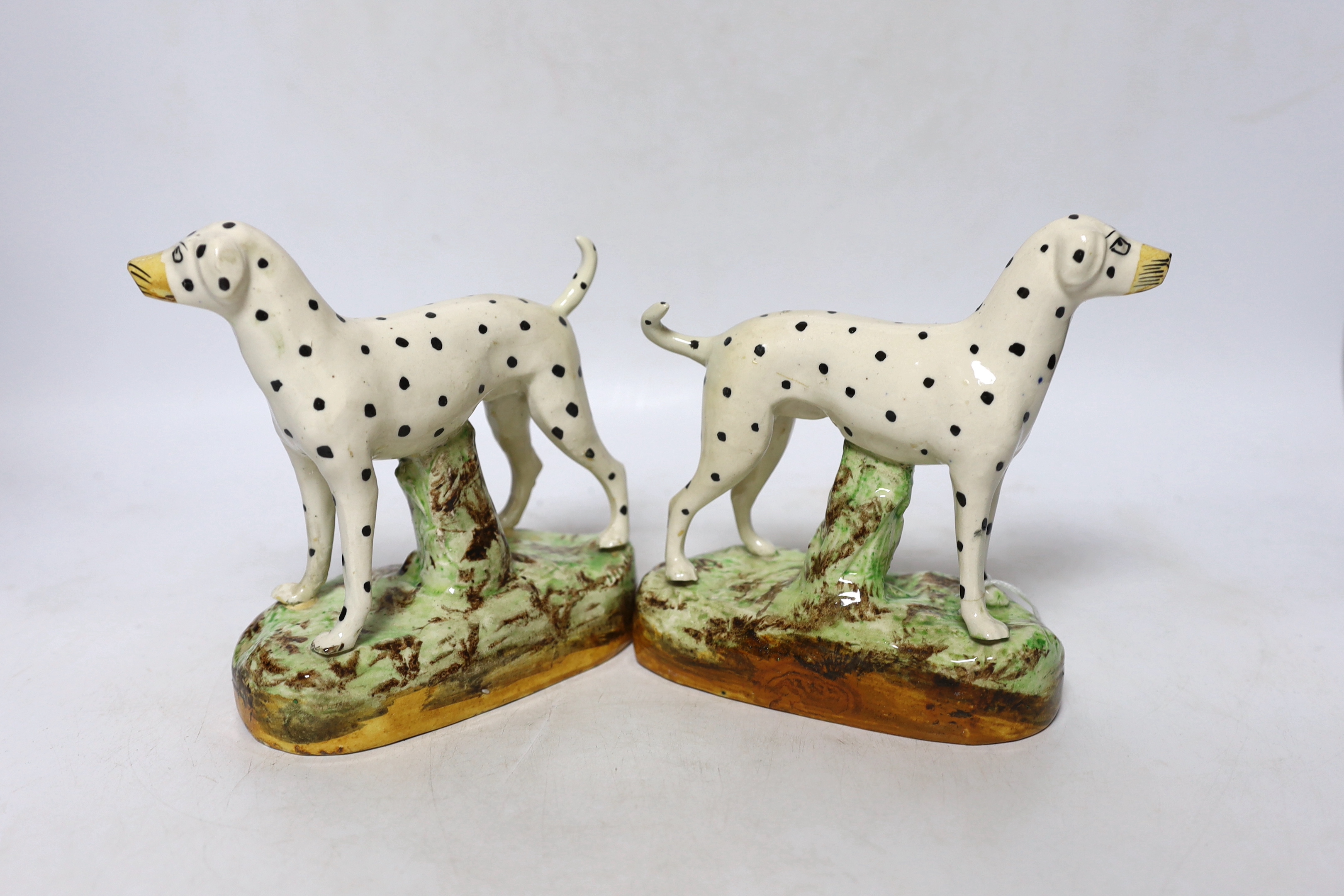 A pair of Staffordshire pottery figures of Dalmatians, 16cm